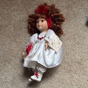 Classic Porcelain Girl Doll in White and Red Dress Plays Music